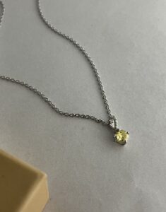 Silver Infinity Twist Golden Drop Necklace