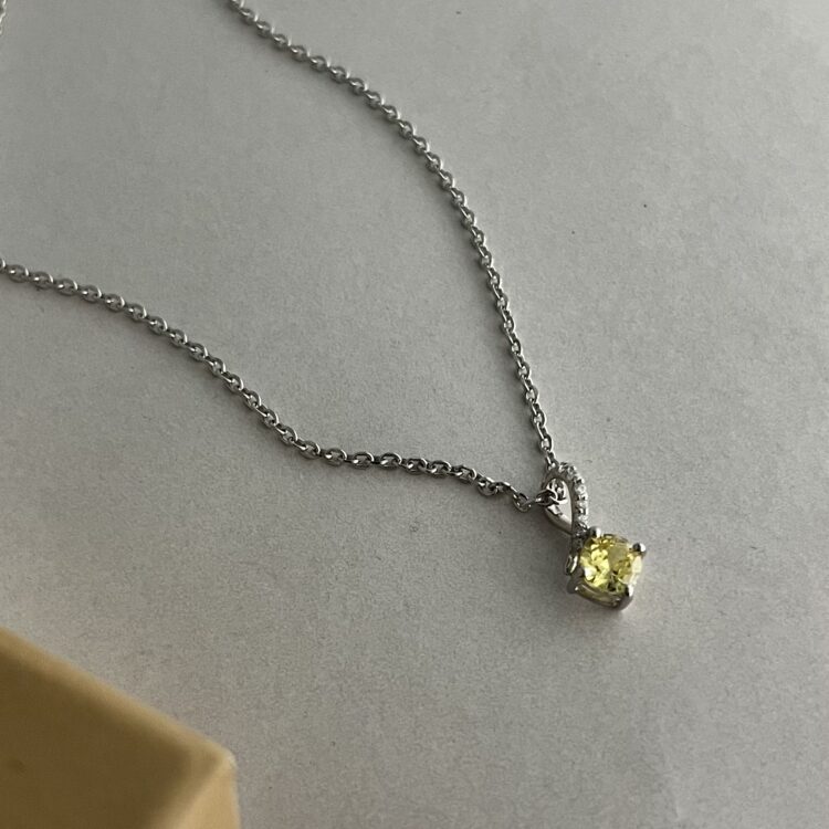 Silver Infinity Twist Golden Drop Necklace